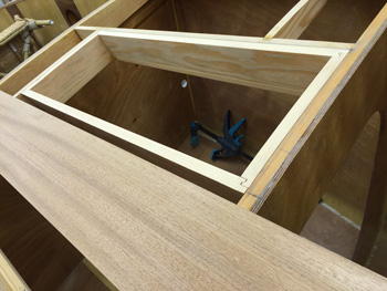 the forward hatch frame trimmed to the deck profile